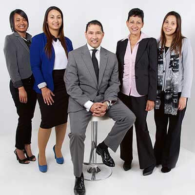 QuikJob recruitment team in US office discussing hiring strategy